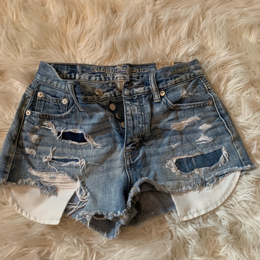 light denim ripped jean shorts with long pockets